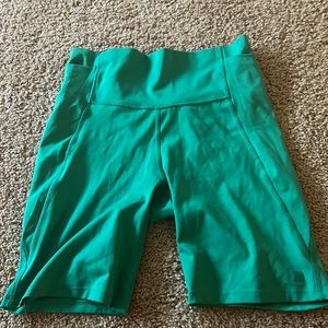 Green athletic biker shorts